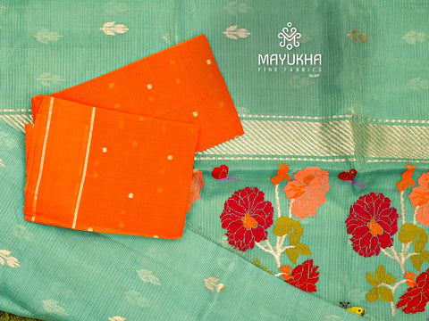 Aqua green zari kota saree with orange blouse