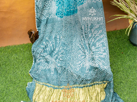 Aqua blue and grey bandhej saree with gold pallu